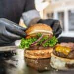 Someone Putting a Burger Together