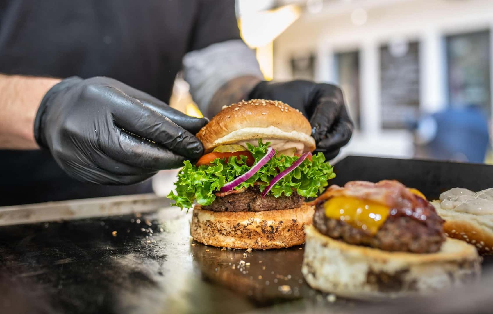 Someone Putting a Burger Together