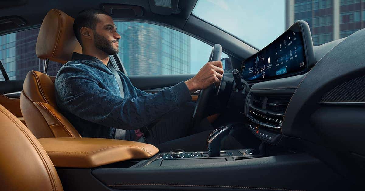 2025 Cadillac CT5 with a driver and the interior dashboard