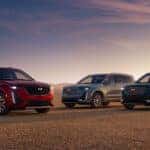 2025 Cadillac XT6 models in three different colors