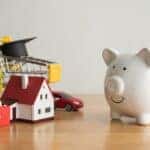 Piggy bank looking at many expense (mortgage loan, education, car, medical, etc). Savings management for vary expense in crisis, home finance, household debt, saving planning for future wealth concept