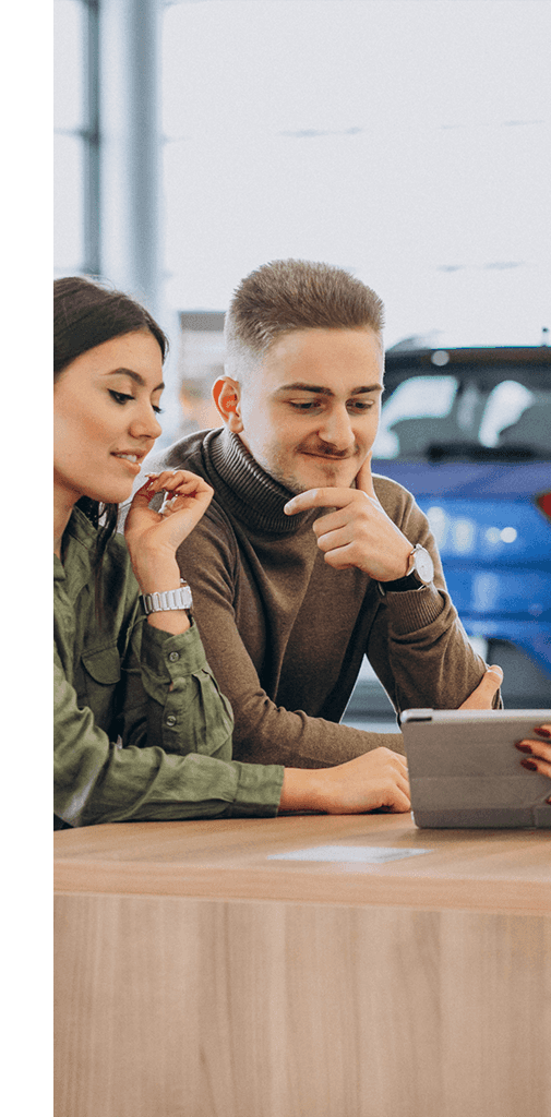 Defining APR at CMA's Toyota of Martinsburg in Martinsburg, WV | Couple together sitting at a table inside of a dealership