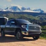 2020 Toyota Tundra towing on dirt path