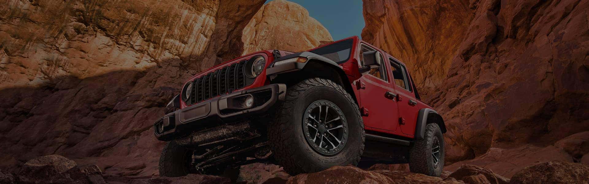 Angled view of a red Jeep