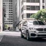 white BMW in city streets