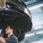 mechanic under BMW carlift