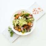 cooked food with sliced vegetables in white bowl by Hermes Rivera is licensed with Unsplash License