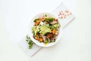 cooked food with sliced vegetables in white bowl by Hermes Rivera is licensed with Unsplash License