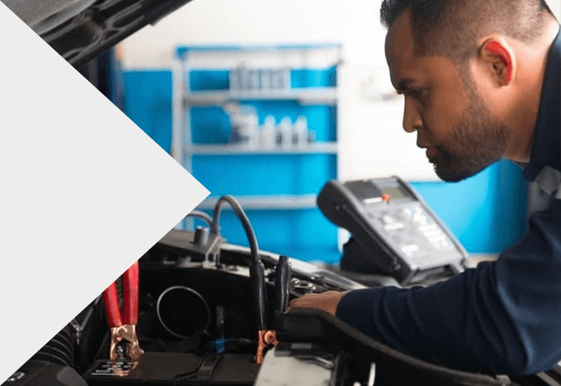 Acura Technician testing car battery