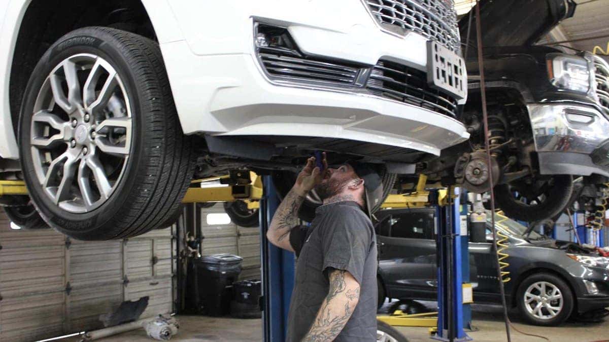 GMC Denali SUV on a lift in the Jim Taylor Buick GMC service department in Monroe, LA