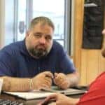 Customer working with a salesperson at Jim Taylor Buick GMC in Monroe, Louisiana