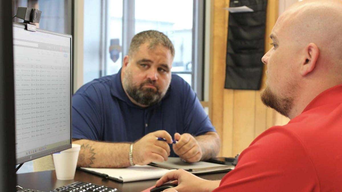 Customer working with a salesperson at Jim Taylor Buick GMC in Monroe, Louisiana