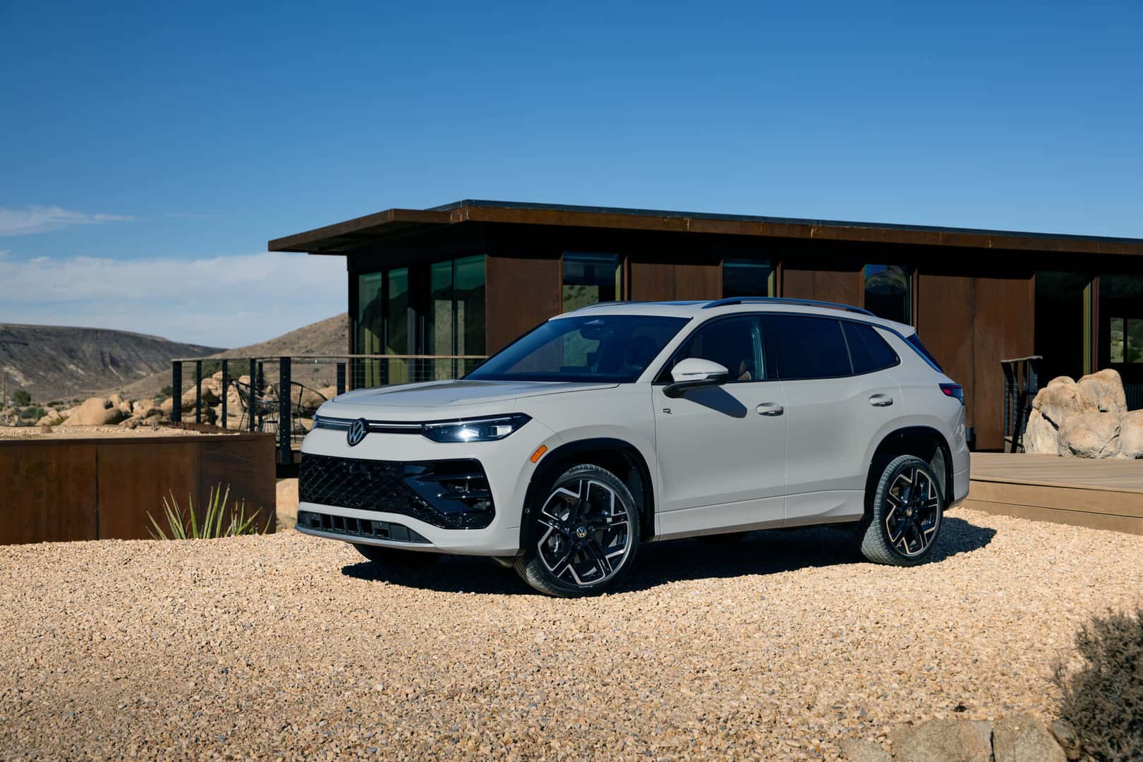 Volkswagen Tiguan parked outside of house in the desert
