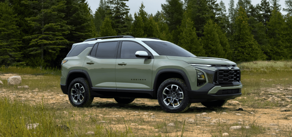 2026 Chevrolet Equinox parking outdoor with the woods in background