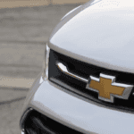 white chevrolet car on road during daytime