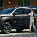 2026 Chevrolet Tahoe parked outside a modern home