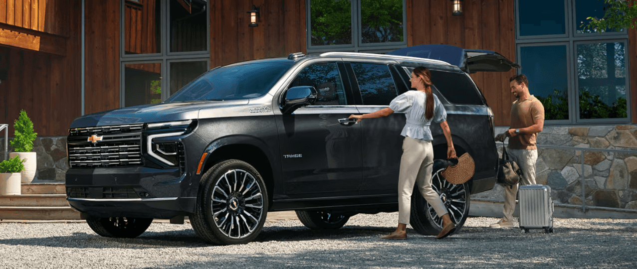 2026 Chevrolet Tahoe parked outside a modern home