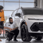 Chevrolet service advisor explaining genuine parts to customers in the service bay