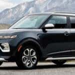 Kia Soul parked with mountains in background