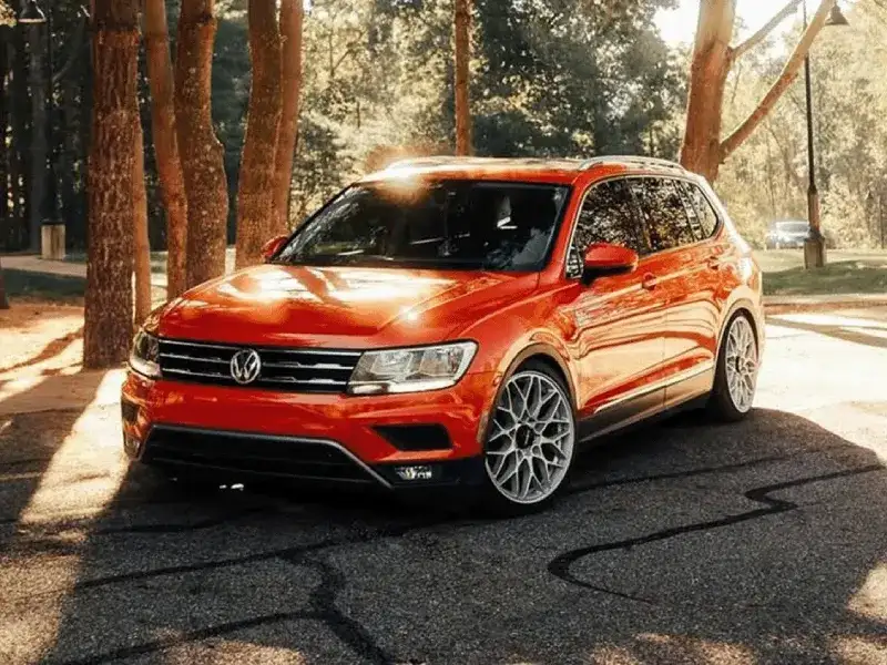 orange Tiguan in parking lot