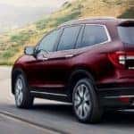 Red 2020 Honda Pilot on Highway