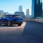 2025 Cadillac Lyriq with blue exterior parked on city building roof top