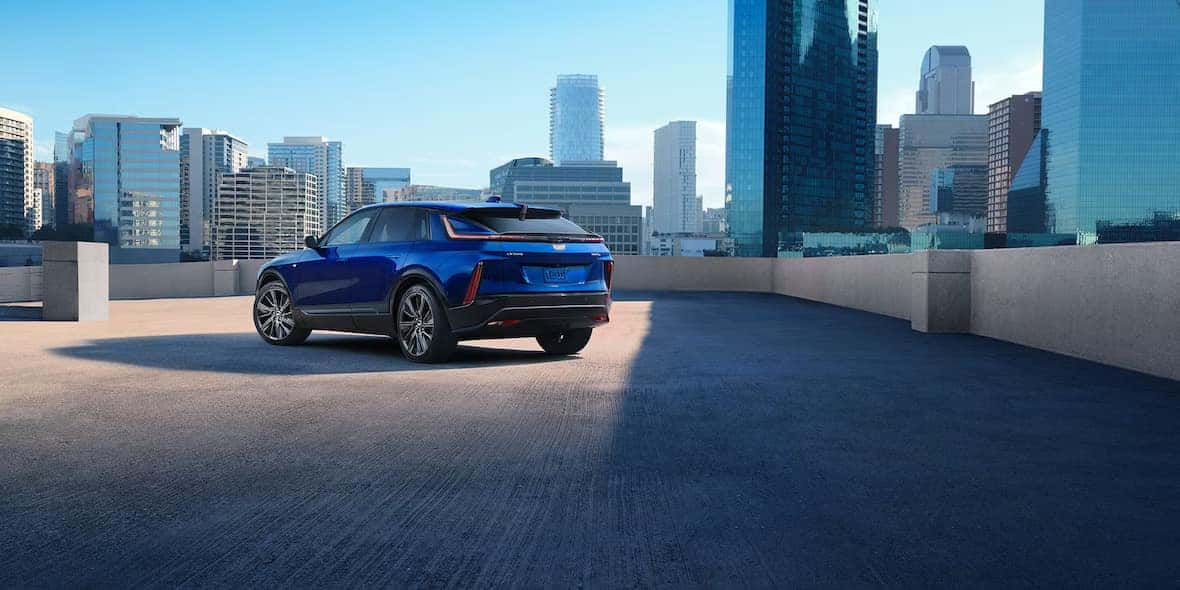 2025 Cadillac Lyriq with blue exterior parked on city building roof top