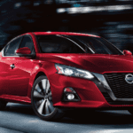 2020 Nissan Altima in red driving on LA city street
