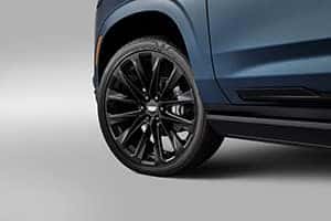 2025 Cadillac Escalade featuring bold 24" wheels that enhance its commanding presence and luxurious design.