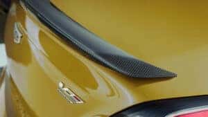 2025 Cadillac CT4-V featuring bold carbon fiber accents, highlighting its performance-driven design and aerodynamic styling.