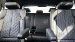 2026 Cadillac Escalade IQ interior showcasing the spacious and well-appointed second-row seating with ample room for passengers and cargo at Patrick Cadillac.