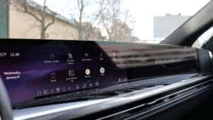 2026 Cadillac Escalade IQ interior highlighting Google Built-In compatibility on the curved LED display for seamless access to apps and connectivity at Patrick Cadillac.