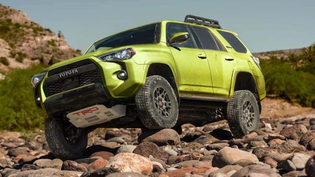 2022 toyota 4runner using 4 wheel drive capability to climb a rocky terrain