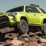 2022 toyota 4runner using 4 wheel drive capability to climb a rocky terrain