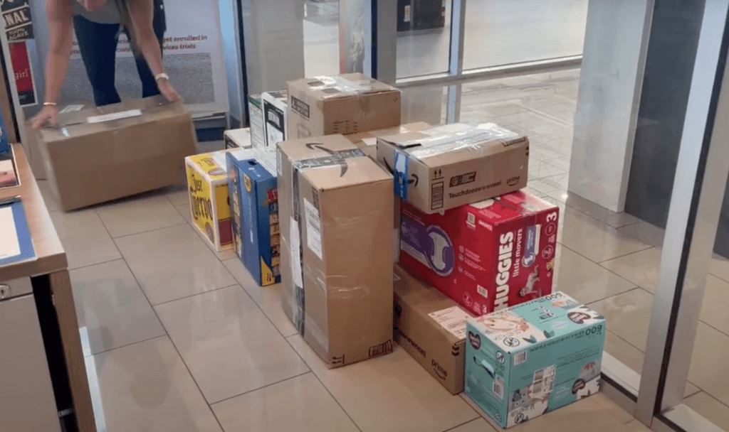 Various supplies including diapers and chips to be loaded and distributed to Western NC.