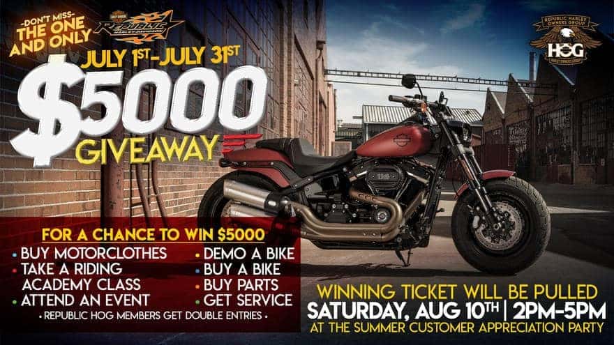 5K Giveaway motorcycle parked next to building