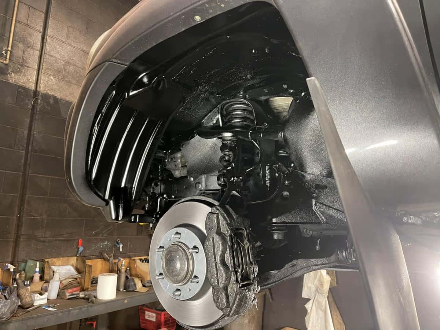 Wheel well and suspension fully coated in KS-500 after rust proofing