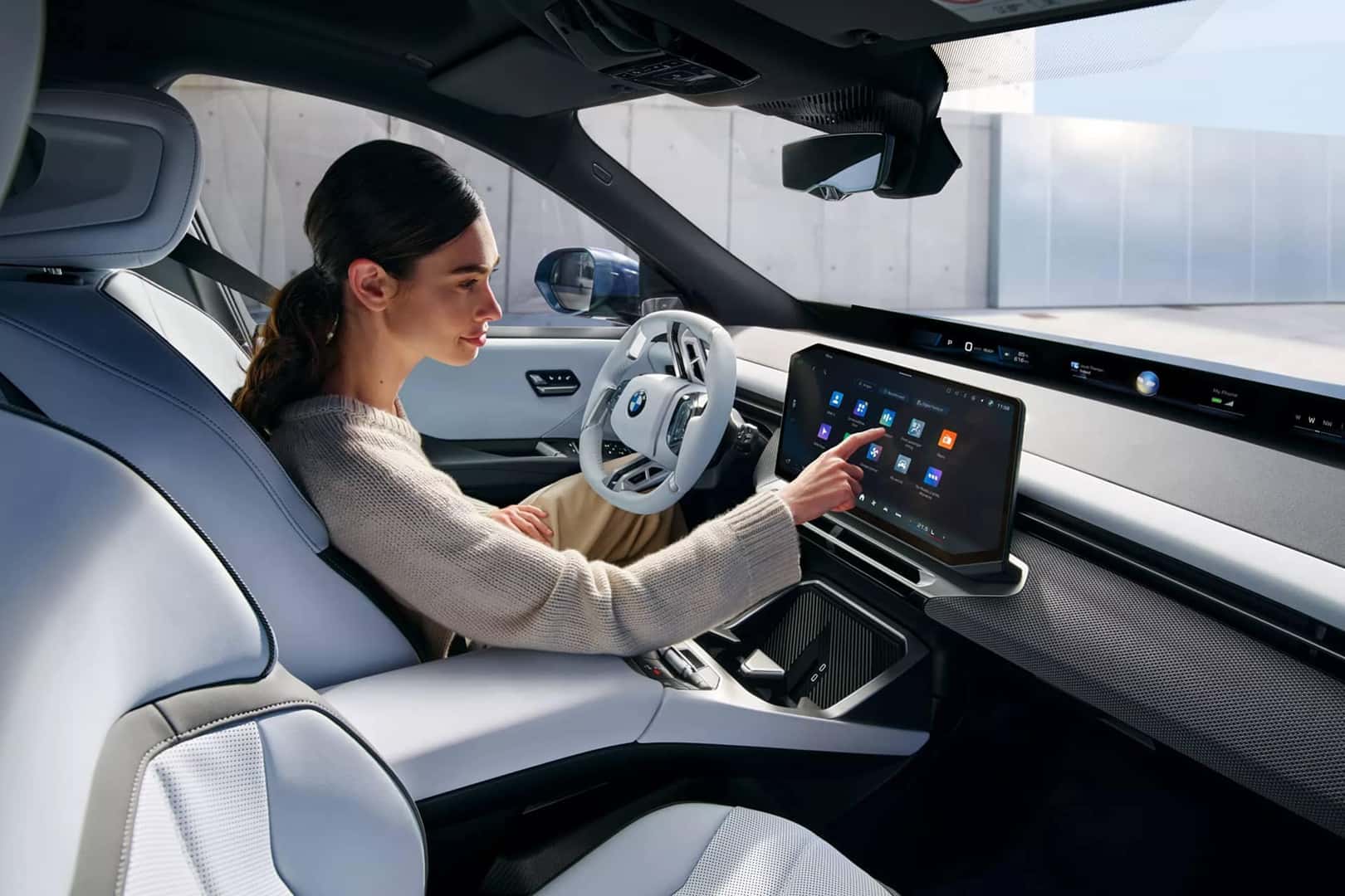 woman on touch screen of bmw ix3
