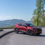 The Impressive And Versatile 2024 Chevy Trax, Parked Epically On A Road, Near A Mountain Edge With An Excellent View