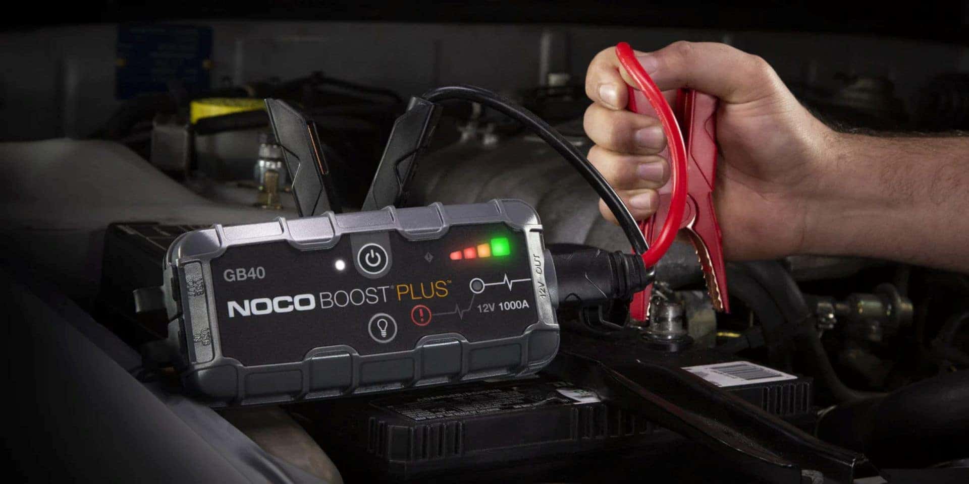 The Dependable Portable Jump Starter Being Used By A Prepared Driver