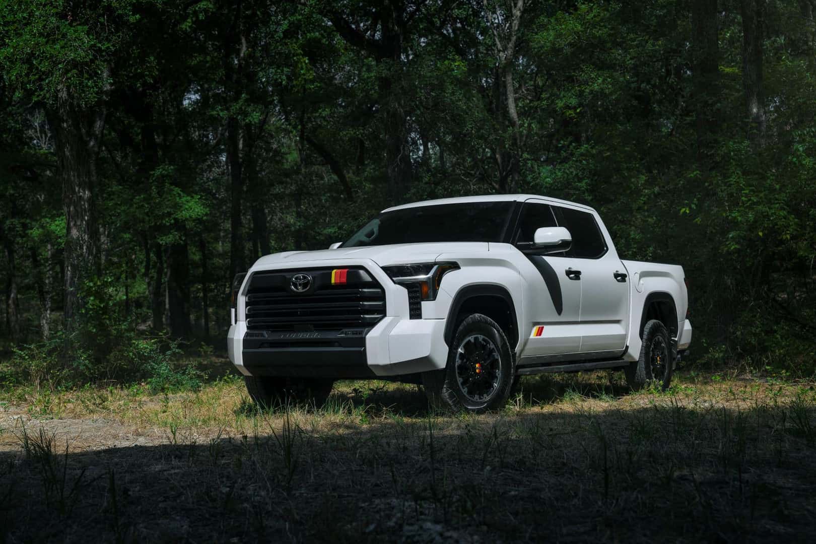 The Flexible And Turbo-Charged 2025 Toyota Tundra TRD Rally Package, Parked At The Tree Line