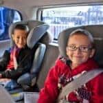 Two Cute Children In A Toyota's 4Runner's Third Row, Safely Secured In Their Child Seats