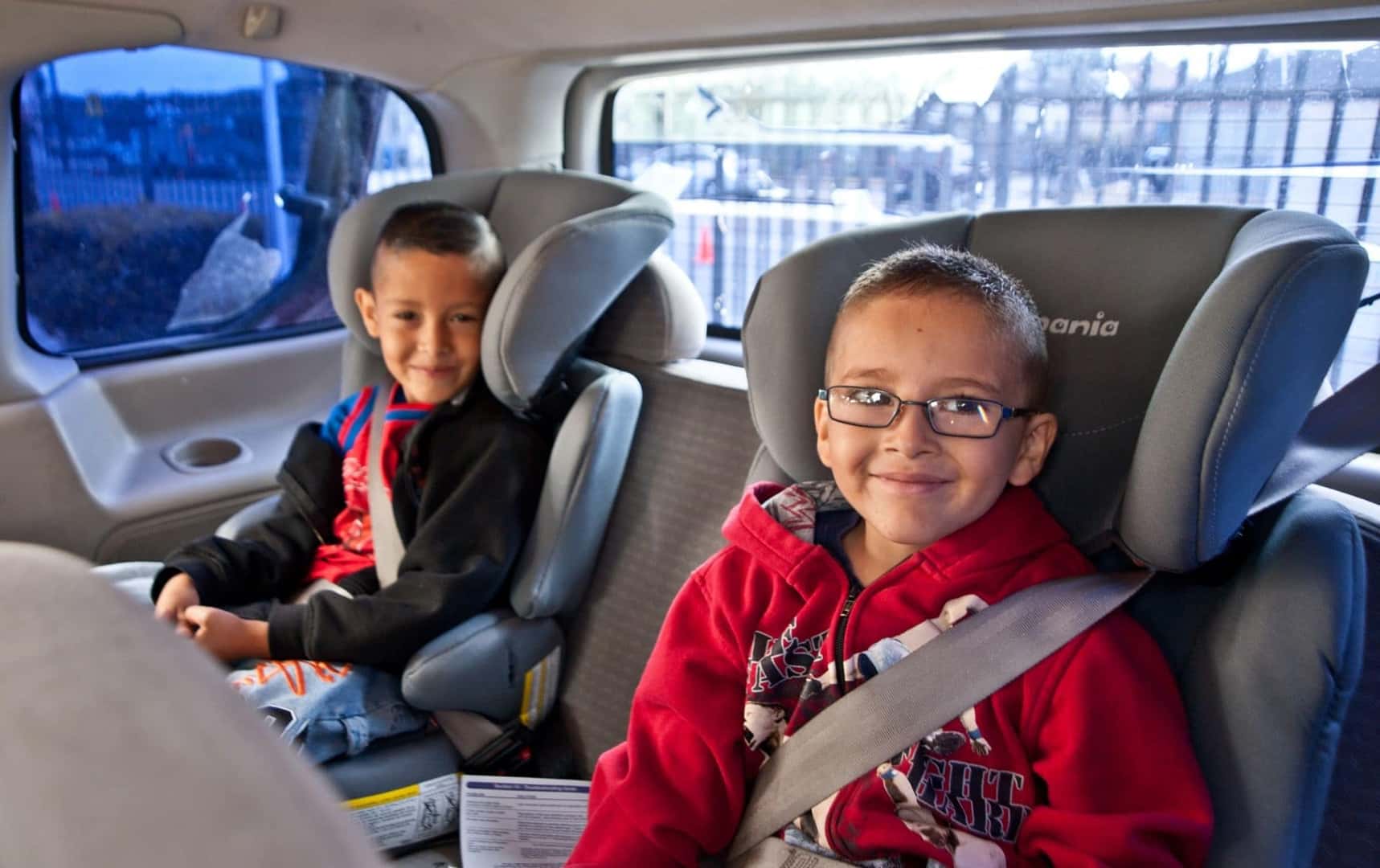 Two Cute Children In A Toyota's 4Runner's Third Row, Safely Secured In Their Child Seats
