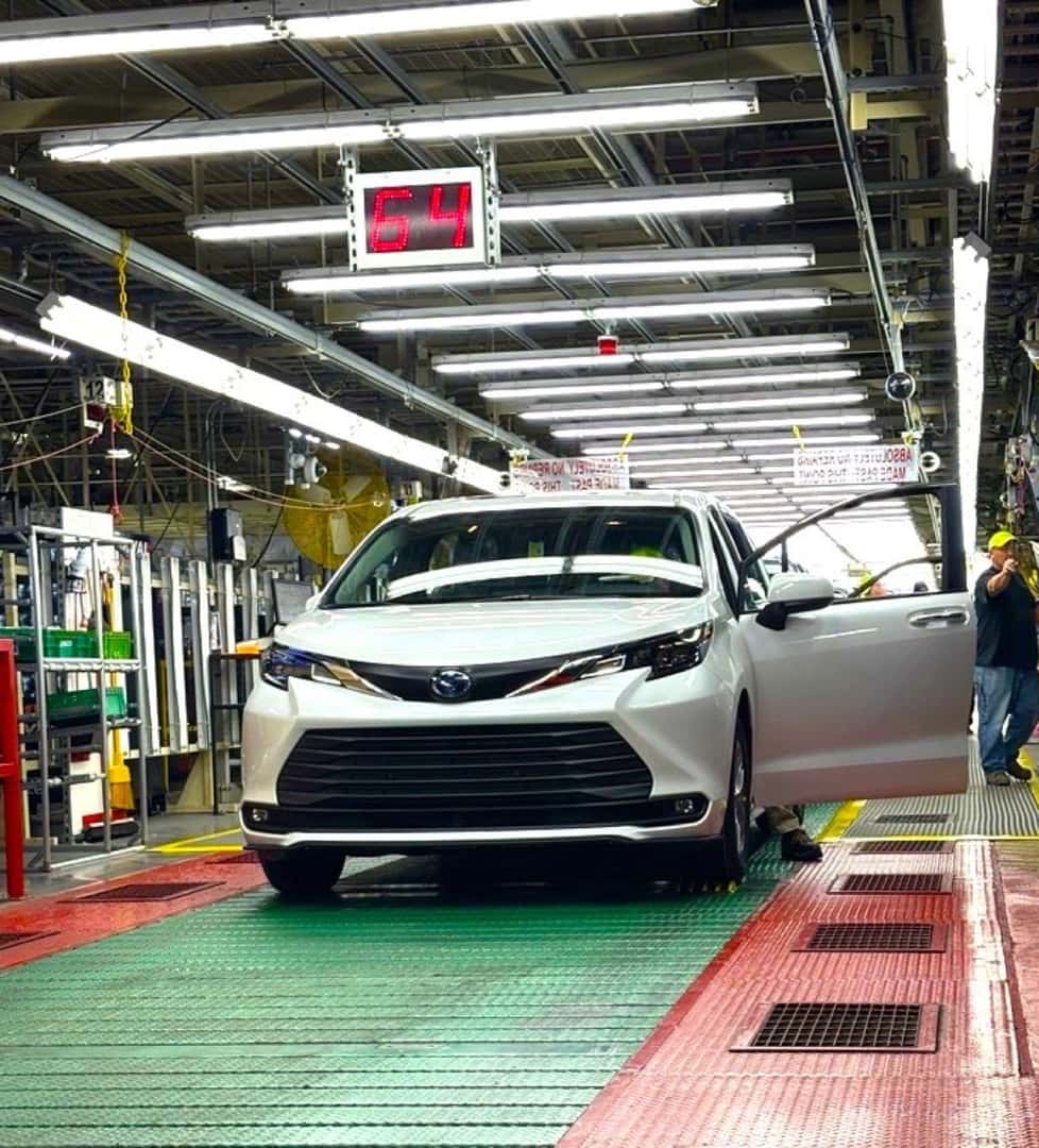 The Toyota Sienna Park In A Brightly Lighted Hall IN An Automotive Workshop
