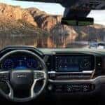 The Fashionable Black And Silver Interior Of The 2026 Chevrolet Silverado, The Front Windshield Overlooking A Glorious, Expansive Lake