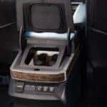 The 2025 Toyota Sienna Platinum's Large FridgeBox And Multiple Charging Ports Between The Two Comfortable Front Seats