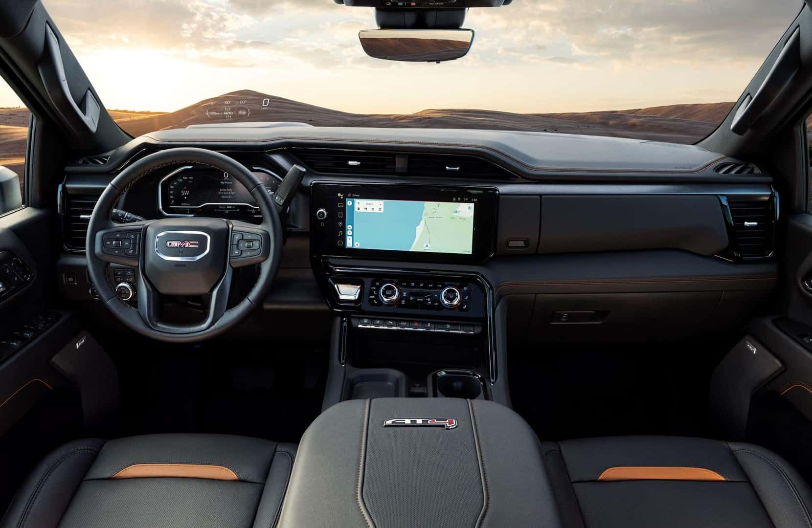 The Sleek Black Interior Of The Technologically Advanced 2024 GMC Sierra 2500 HD AT4