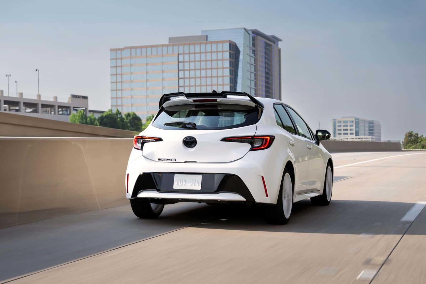The Fancy Rear View Of The Modernized 2026 Toyota Corolla Hatchback FX, Driving On The Interstate