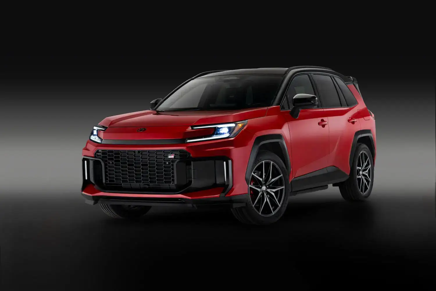 2026 red Toyota Rav4 front view with a black and gray background