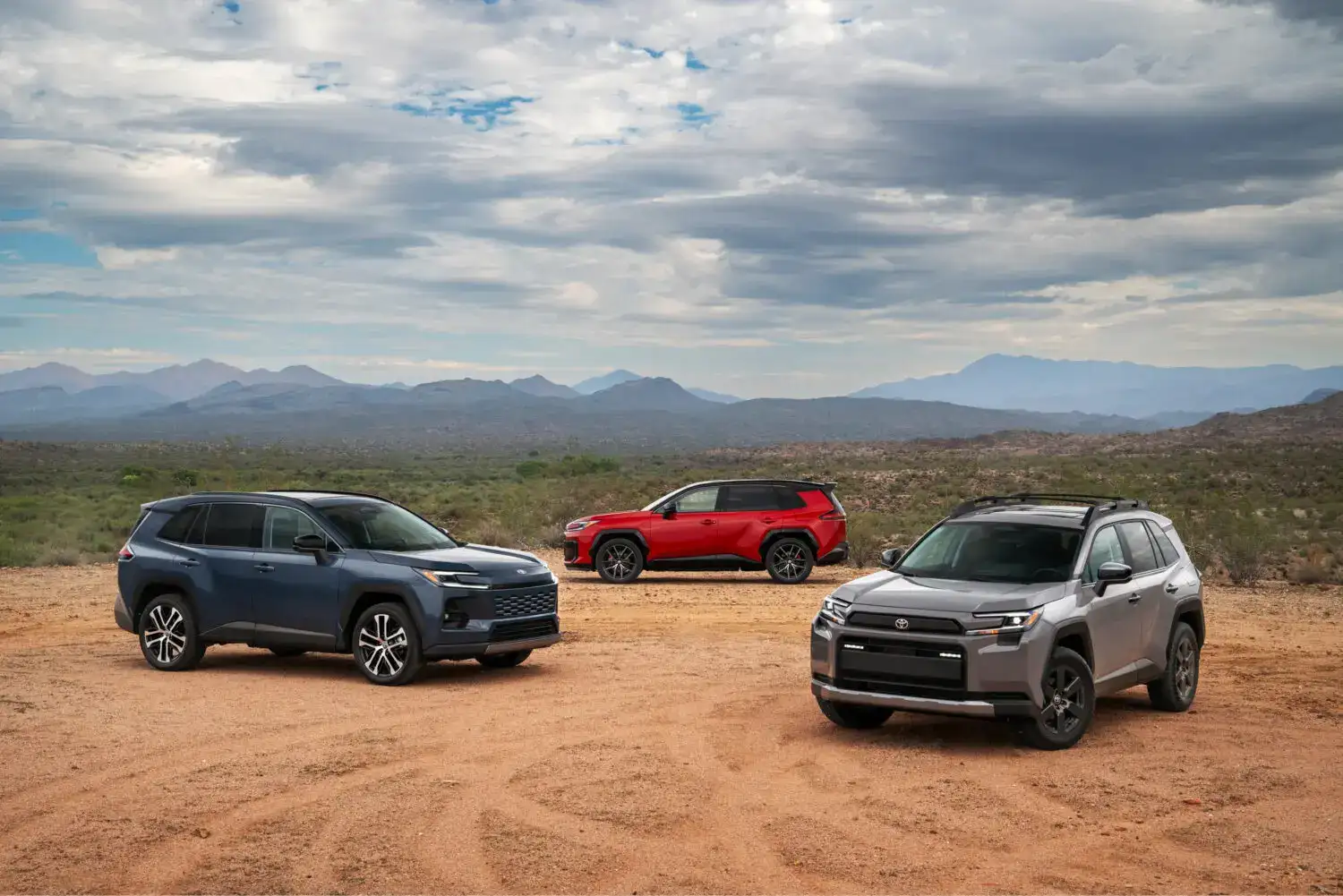 Three 2026 Toyota Rav4 parked off road